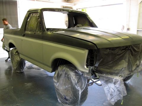 1992 Ford Bronco - 1992 Ford Bronco is prepped for painting, with wheels and front end covered in plastic.