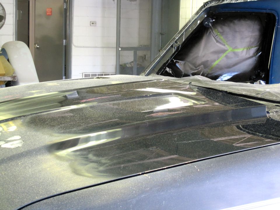 Hood scoop on a vehicle undergoing repair