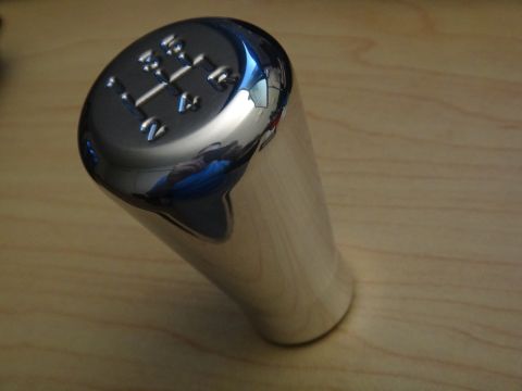 1995 Ford Taurus - Chrome shift knob displays a 5-speed manual gear pattern.