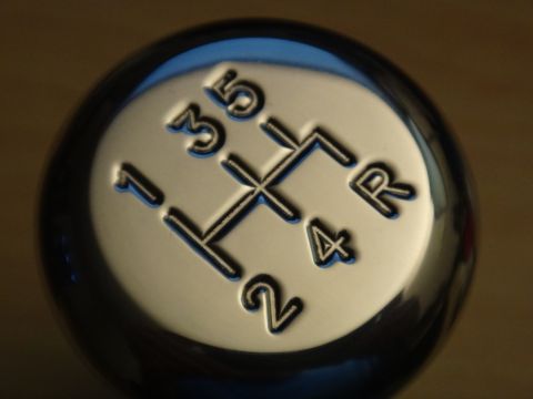 1995 Ford Taurus - The shift knob displays a 5-speed manual gear pattern, including reverse.