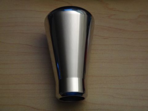 1995 Ford Taurus - A shiny, tapered shift knob is shown against a wood-grain background.