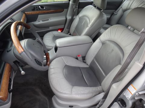 2000 Lincoln Continental - The interior of a 2000 Lincoln Continental features plush leather seats and elegant wood accents.