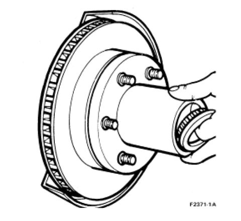 1995 Ford Bronco - Illustration of a brake rotor and hub assembly with a hand installing a bearing.