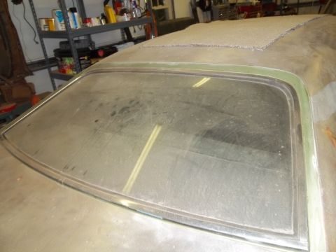 1971 Dodge Dart - Rear view of a dusty 1971 Dodge Dart showing the window and roof.