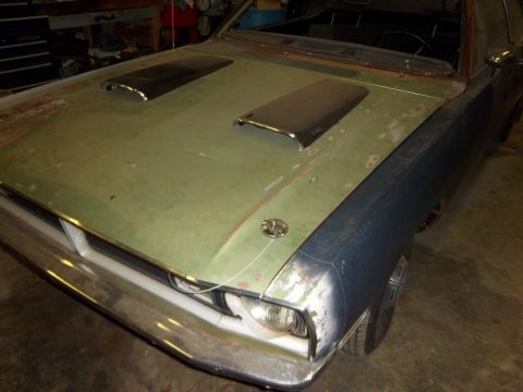 1971 Dodge Dart - Front view of a 1971 Dodge Dart, showing its hood scoops and unfinished bodywork.