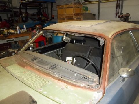 1971 Dodge Dart - Interior view of a 1971 Dodge Dart, showing the dashboard and seats. The vehicle appears to be undergoing restoration.