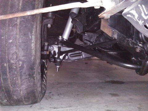 1971 Dodge Dart - Close-up view of a vehicle's front suspension system and tire.