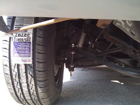 1971 Dodge Dart - Car suspension parts and a tire are visible, with a tire size tag attached.
