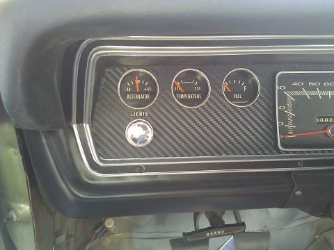 1971 Dodge Dart - Interior view of a vehicle's dashboard, showing various gauges and controls.