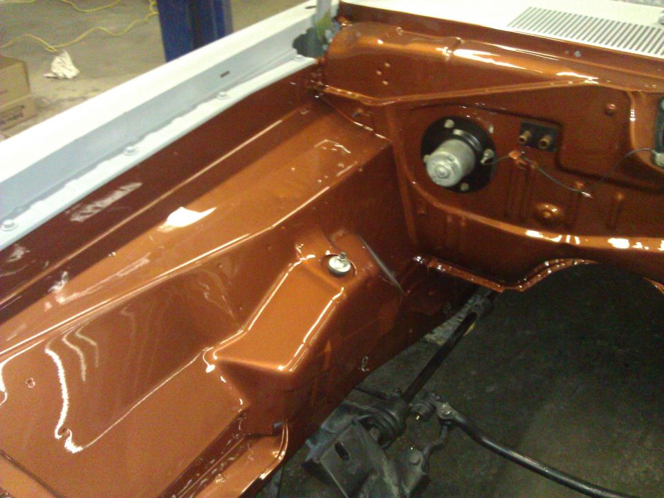 1971 Dodge Dart engine bay with fresh orange paint and some components installed