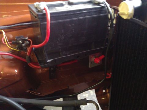 1971 Dodge Dart - Close-up view of a car battery and electrical components, including a kill switch.