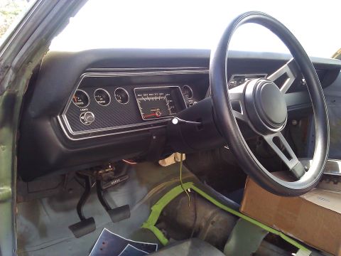 1971 Dodge Dart - The dashboard of a 1971 Dodge Dart features a speedometer and several gauges.