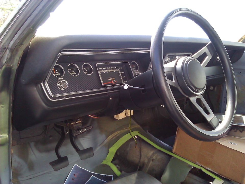 1971 Dodge Dart interior showing dashboard, steering wheel, and pedals