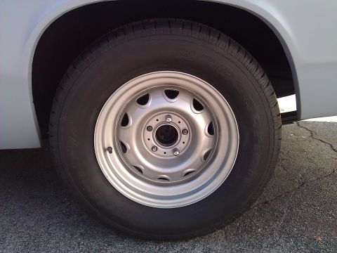 1971 Dodge Dart - This image shows a close-up view of a vehicle's wheel and tire, with visible text on the tire sidewall.