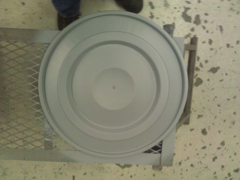 1971 Dodge Dart - A gray air cleaner lid is shown from above, placed on a metal rack.