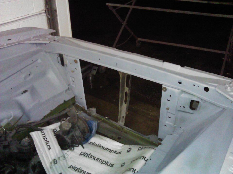 1971 Dodge Dart engine bay, primed and ready for restoration