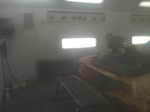 1971 Dodge Dart - Car body undergoing paint work in a professional spray booth environment.