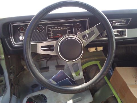 1971 Dodge Dart - The interior of a 1971 Dodge Dart displays its dashboard, steering wheel, and center console.