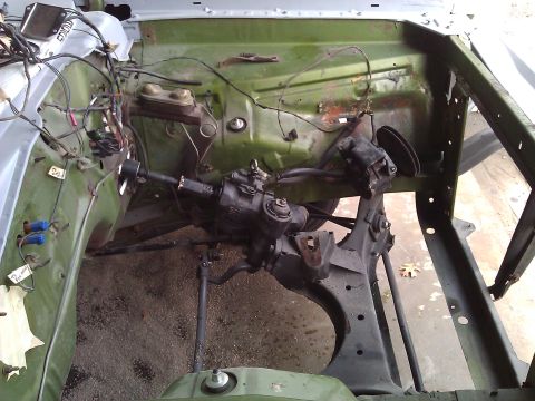 1971 Dodge Dart - The engine bay of a car is shown, focusing on the steering mechanism and brake system components.