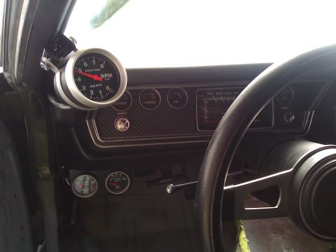 1971 Dodge Dart - Interior view of a 1971 Dodge Dart dashboard, showing the tachometer and steering wheel.