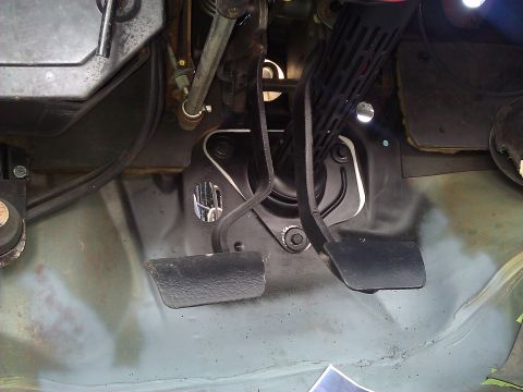 1971 Dodge Dart - Close-up of car pedals and linkage mechanism.
