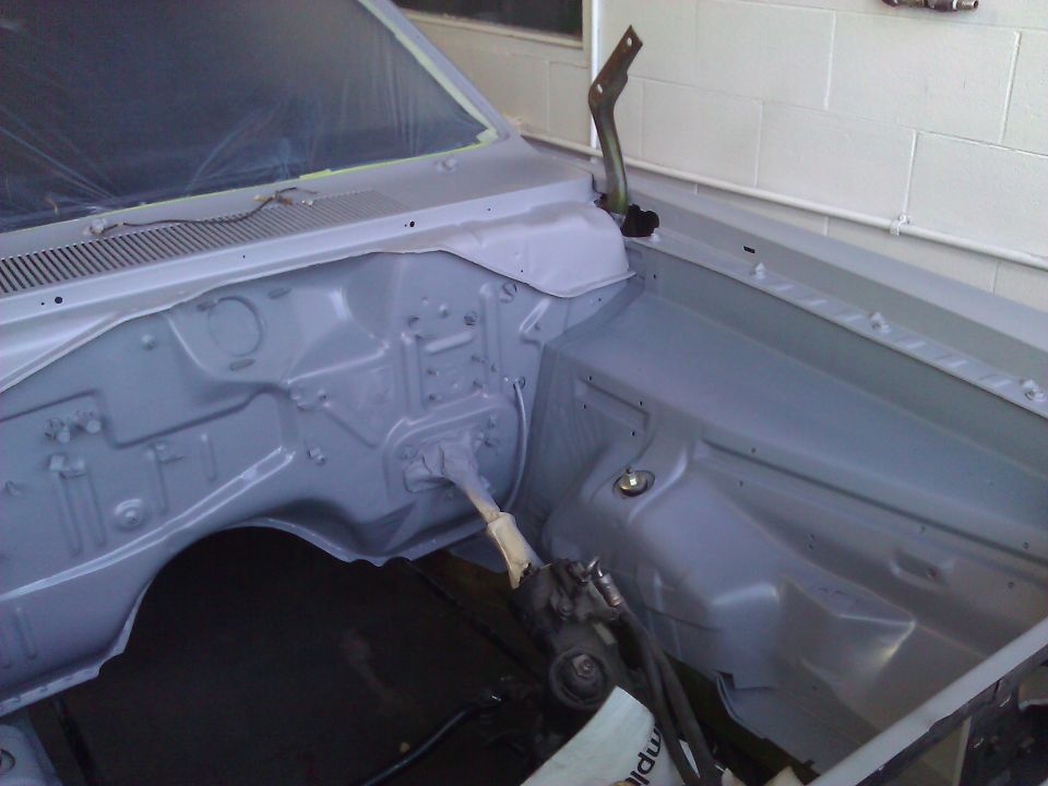 1971 Dodge Dart engine bay, freshly painted gray, with some parts removed