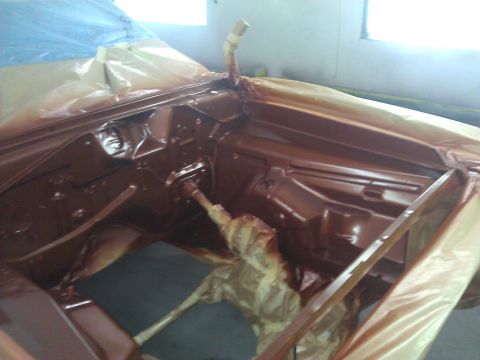 1971 Dodge Dart - The interior of a 1971 Dodge Dart is being painted brown, with plastic sheeting protecting exposed areas.