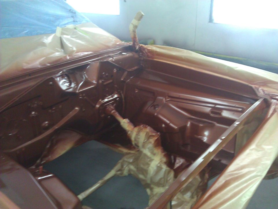 Brown painted car interior, dashboard and firewall area, covered in plastic sheeting