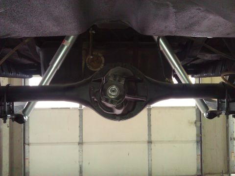 1971 Dodge Dart - Rear axle and suspension components are visible from underneath a vehicle.