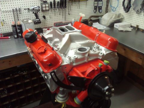1971 Dodge Dart - Engine assembly on a workbench with tools and parts in the background.