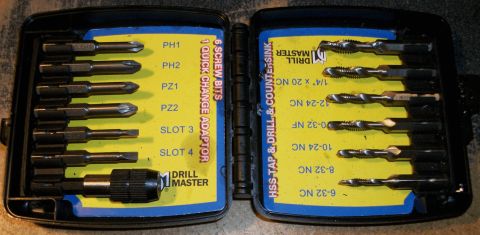 1996 Ford Bronco - A black plastic case is open, revealing two yellow inserts with tool bits. The left insert holds six screw bits and a quick change adapter,…