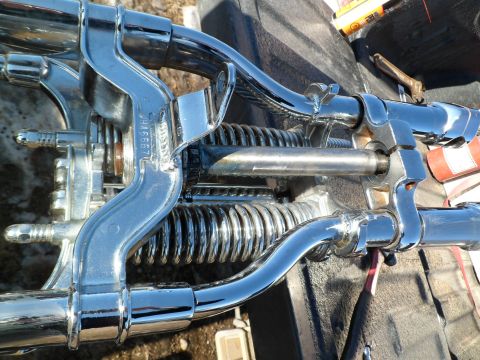 1973 Harley-Davidson Ultra - Close-up of a blue wiring harness and engine parts, likely from a motorcycle.
