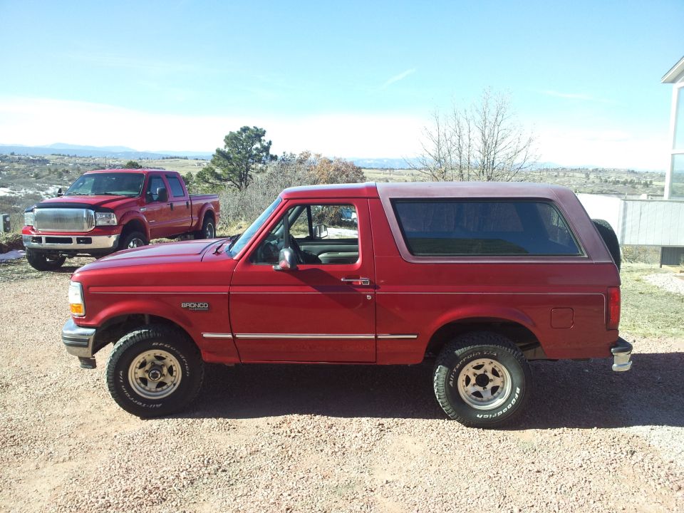 red 1996 Ford Bronco parked outside on a sunny day