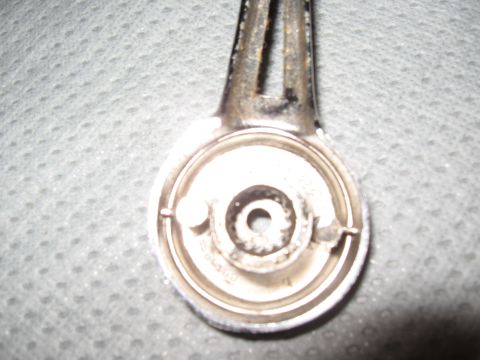 1968 Shelby GT500 - Interior door handle mechanism shown from the back, with visible gears and mounting points.