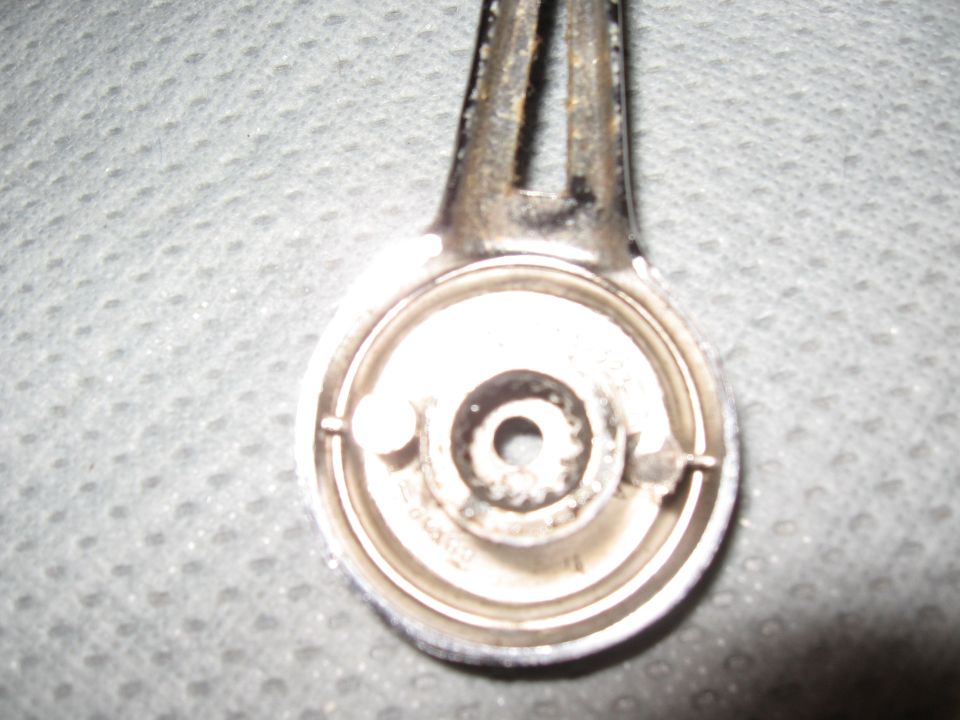 Close-up of the internal mechanism of a chrome door handle
