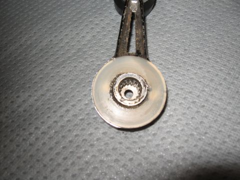 1968 Shelby GT500 - This is a close-up view of a car's window crank mechanism, showing its internal components.
