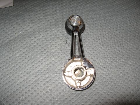 1968 Shelby GT500 - Chrome window crank handle with black knob, viewed from the back.