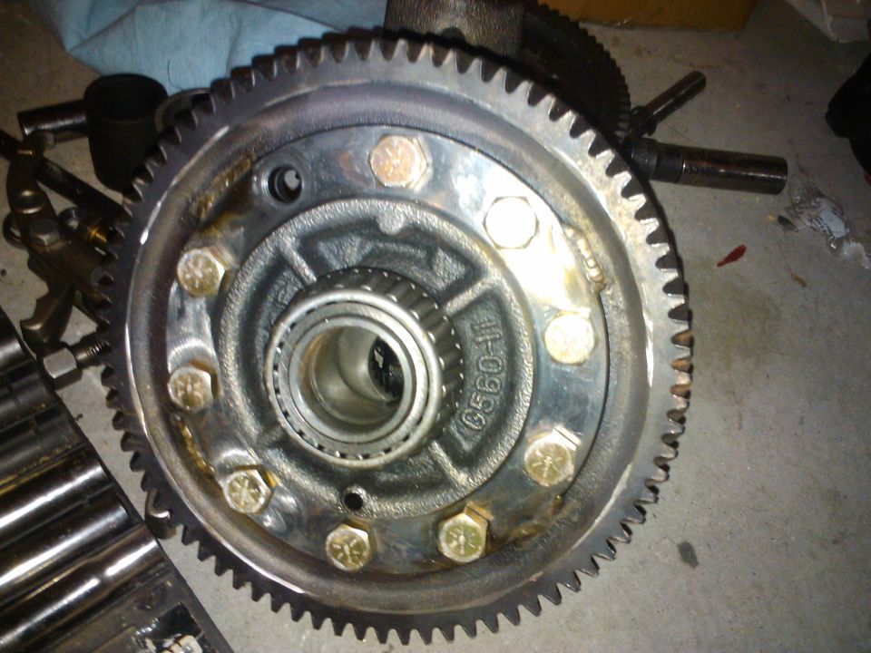 close-up of a differential gear assembly with bolts and a bearing