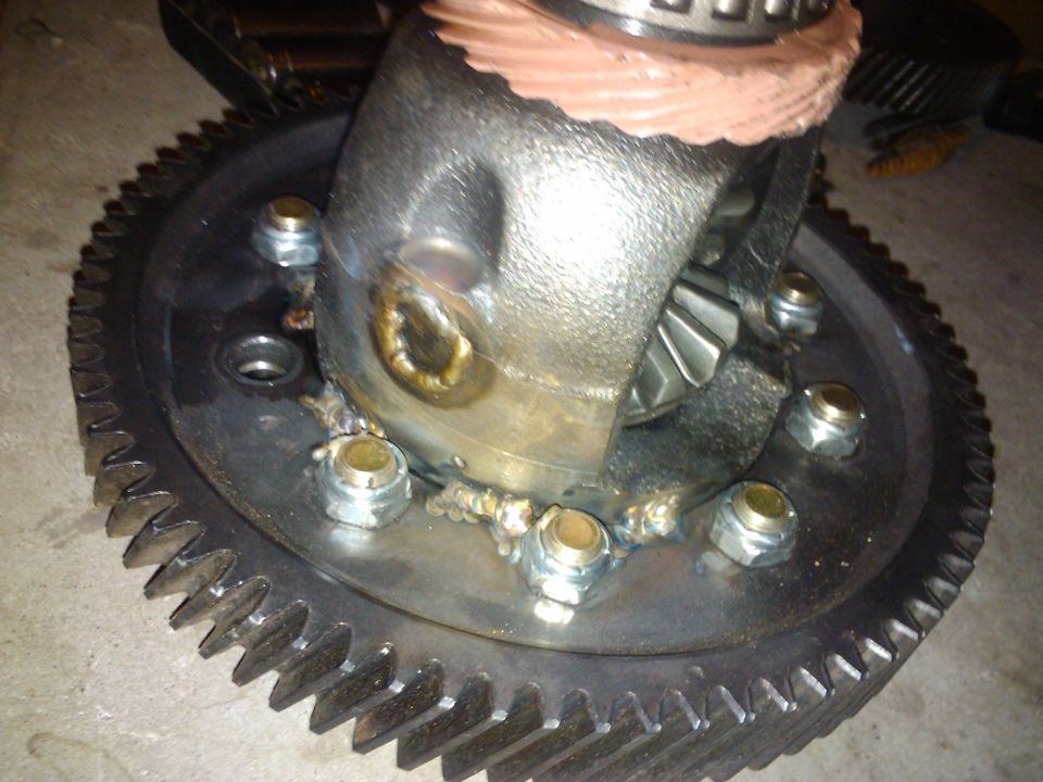 Differential gear assembly with a large ring gear, bolted together with nuts and welded