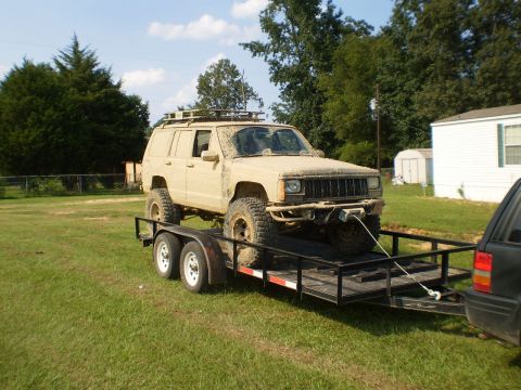 1992 Jeep Cherokee - This modified Jeep Cherokee is loaded onto a trailer, ready for its next off-road adventure.