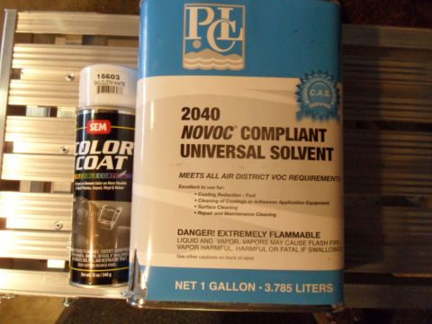 1994 Jeep Cherokee - Automotive paint and solvent products are displayed together on a metallic surface.