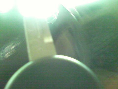 1988 Ford F-150 - Close-up of an interior vehicle component, obscured by bright light and blur.
