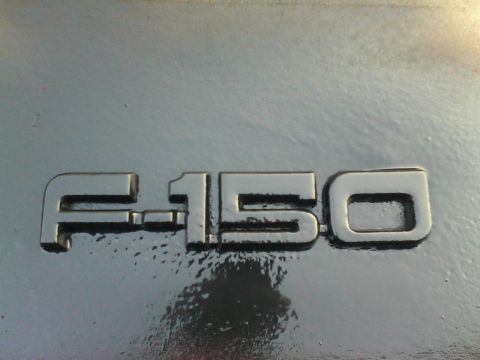 1988 Ford F-150 - F-150 badge detail on a vehicle part. Supermotors.net watermark is visible.