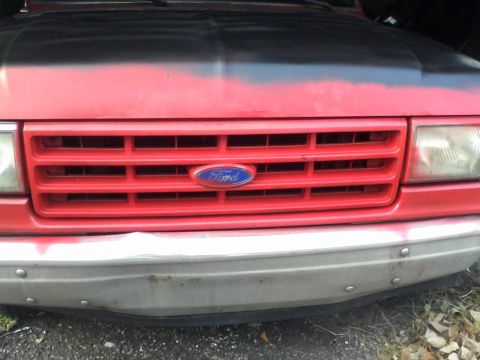 1988 Ford F-150 - Front view of a 1988 Ford F-150, showing the grille and bumper.