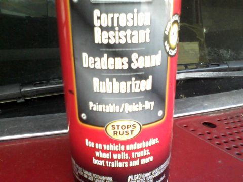 1988 Ford F-150 - A can of undercoating spray is shown resting on a vehicle's hood.