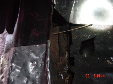 1988 Ford F-150 - This photo shows significant rust and repair work on metal components, possibly from a vehicle's body.