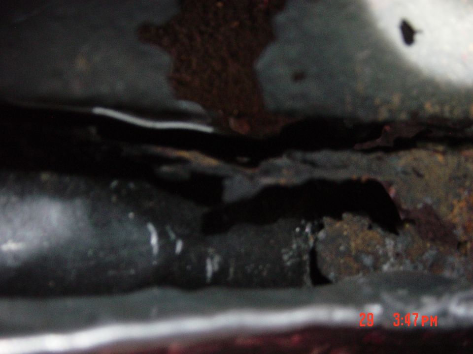 rusted metal frame with water droplets and a white line