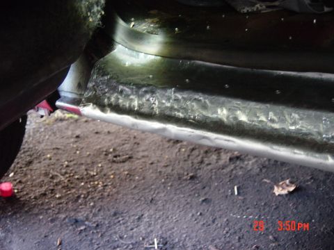 1988 Ford F-150 - Rusted rocker panel on a vehicle, likely undergoing repair or restoration.