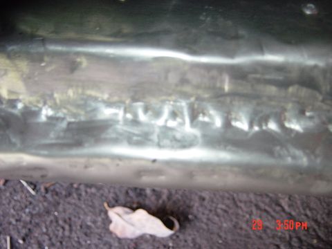 1988 Ford F-150 - This is a close-up view of a metal component, showing signs of welding work.