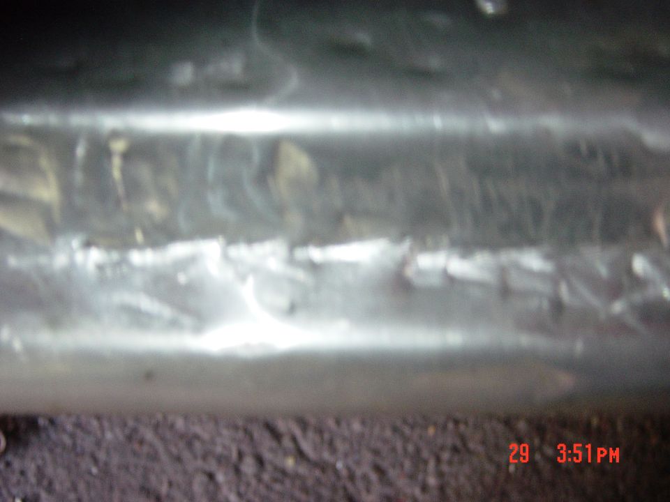 Close-up of textured chrome trim, possibly from a vehicle